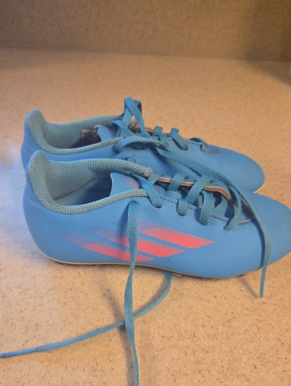 Kids Blue Adidas Soccer Cleats with Pink Accent